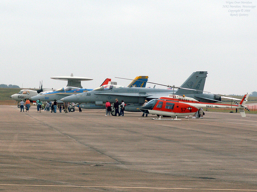 Huey, two FA-18 Hornets, E-2D Buckeye